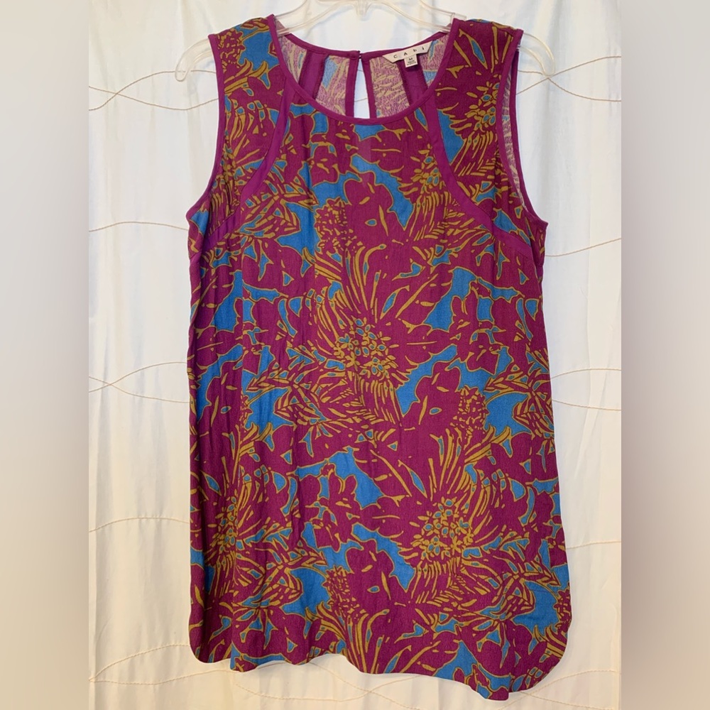 CAbi blouse. Size medium in excellent preowned. Color is more raspberry.